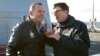 FILE - Then-Australian Prime Minister Tony Abbott, left, speaks with U.S. Ambassador John Berry on the USS Blue Ridge as it arrives in Sydney, July 3, 2015. The U.S. currently has no ambassador in Australia.