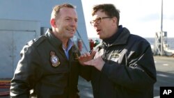 FILE - Then-Australian Prime Minister Tony Abbott, left, speaks with U.S. Ambassador John Berry on the USS Blue Ridge as it arrives in Sydney, July 3, 2015. The U.S. currently has no ambassador in Australia.