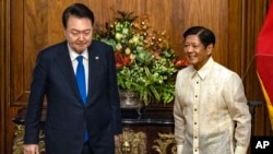 South Korean President Yoon Suk Yeol, left, meets with Philippine President Ferdinand Marcos Jr. at the Malacanang Palace, Oct. 7, 2024 in Manila, Philippines. 