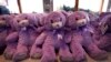 FILE - Rows of "Bobbie Bear", a lavender and wheat stuffed soft toy, sit on a table at the headquarters of Tasmania's Bridestowe Lavender located near the town of Nabowla, Australia.