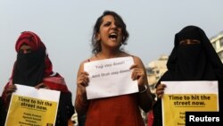 Women hold placards and shout slogans during a protest in solidarity with rape victims and to oppose violence against women in Mumbai, India December 8, 2019.
