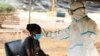 FILE - Uhlolwa umkhuhlane weCOVID-19