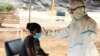 FILE - Kuhlolwa umuntu okucatshangelwa ukuthi ulomkhuhlane weCoronavirus COVID-19 eZimbabwe.