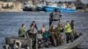 An Egyptian coast guard dinghy brings bodies from a Europe-bound boat that capsized off Egypt’s Mediterranean coast, to the shore in Rosetta, Egypt, Sept. 22, 2016.
