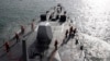 FILE - Taiwan navy soldiers take part during a joint military drill on a Kidd-class destroyer outside a naval base in Kaohsiung, Taiwan, May 15, 2013. 