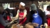 Volunteers, including some Hollywood celebrities, brought holiday cheer on Christmas Eve to residents of a poor Los Angeles neighborhood known as Skid Row, Dec. 24, 2013.