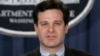FILE - Christopher Wray speaks at a press conference at the Justice Department in Washington. 