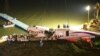 The mangled fuselage of a TransAsia Airways commercial plane is dragged to the river bank after it crashed in Taipei, Taiwan, Feb. 4, 2015. 