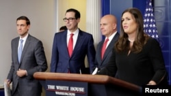 Homeland security adviser Tom Bossert, U.S. Treasury Secretary Steve Mnuchin, national security adviser H.R. McMaster and White House press secretary Sarah Huckabee Sanders announce sanctions against Venezuela, Aug. 25, 2017.