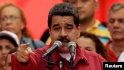 Venezuela's President Nicolas Maduro gives a speech at a rally against U.S President Donald Trump in Caracas, Venezuela, Aug. 14, 2017.