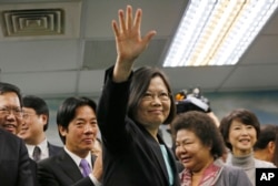 FILE - Taiwan's main opposition Democratic Progressive Party Chairperson Tsai Ing-wen waves at the close of a press conference in Taipei.