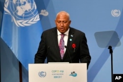 Fiji's Prime Minister Frank Bainimarama talks at the opening of the UN Climate Change Conference in Bonn, Germany, Nov. 6, 2017.