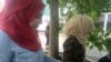Syrian refugees who live in a camp about an hour and a half outside the city at a Dresden, Germany market, enjoying a day far from the camp they live in where anti-immigrant protesters hold demonstrations almost every week, July 7, 2016. (H. Murdock/VOA)