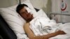 Kasim Genco, 21, a fighter with the Syrian opposition who was wounded during airstrikes on Syrian villages near the Turkey border, lies in his hospital bed in the southeastern city of Kilis, Turkey, Feb. 7, 2016. 
