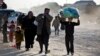 Syrians walk toward Turkish border at the Bab al-Salam crossing, Syria, Feb. 5, 2016.
