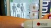 FILE - SolaScan, a new device to detect skin cancer, is demonstrated at its launch in Sydney, Australia, May 7, 2002. Scientists in Australia say in July 2018, they have developed the world's first blood test to detect melanoma in its early stages.