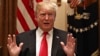 President Donald Trump gestures while speaking about tariffs, Jan. 24, 2019, in the Cabinet Room of the White House in Washington.