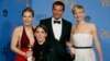 "American Hustle" stars Amy Adams (L), Bradley Cooper and Jennifer Lawrence (R) pose backstage with producer Megan Ellison after the film won the award for Best Motion Picture, Musical or Comedy at the 71st annual Golden Globe Awards, Jan. 12, 2014.