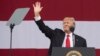 US President Donald Trump gestures during the National Boy Scout Jamboree at Summit Bechtel National Scout Reserve in Glen Jean, West Virginia, July 24, 2017.