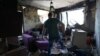 A local resident searches for intact items in his apartment in a residential building destroyed by a rocket attack the day before, in Kyiv, on July 9, 2024, amid Russia's invasion in Ukraine.