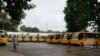 School buses are parked inside the premises of a deserted school compound in Srinagar, Indian controlled Kashmir, Aug. 19, 2019. 