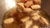 FILE - Stinky tofu is seen fried at the Jiaziyuan Restaurant in New Taipei city.