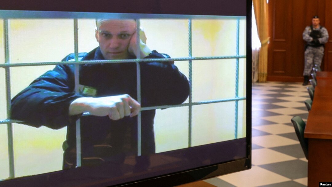 FILE PHOTO: Jailed Russian opposition leader Alexei Navalny is seen on a screen during a court hearing in Moscow