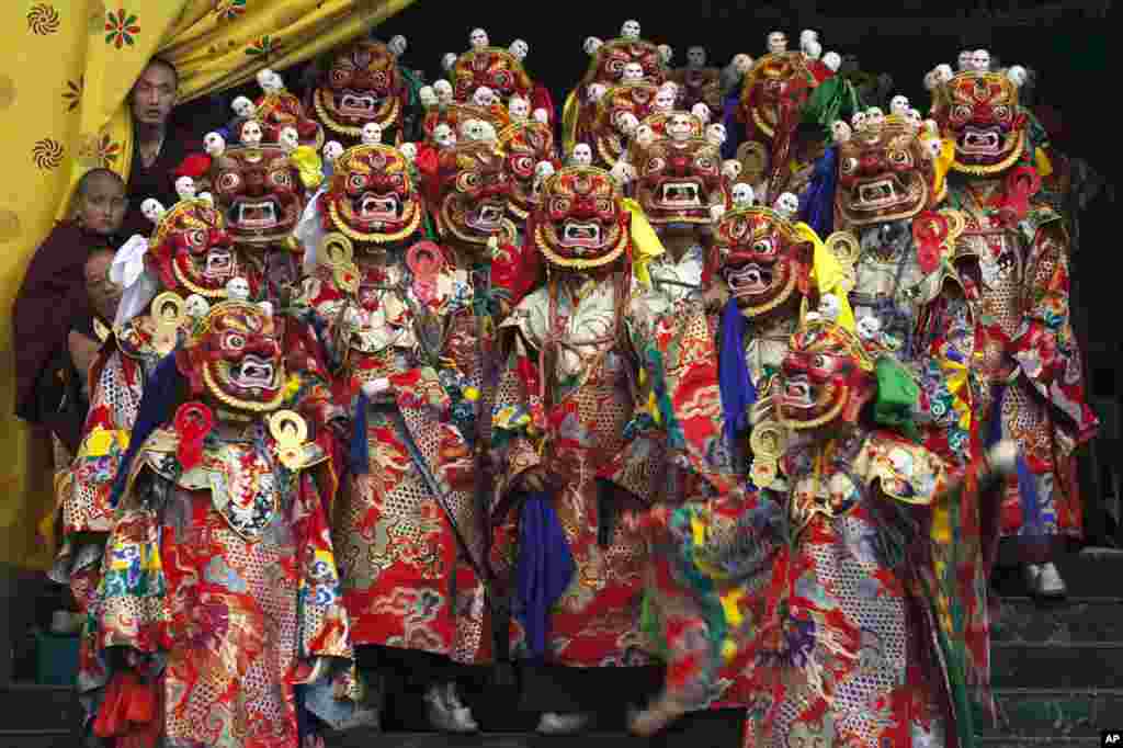 Tibetan Buddhist monks perform a dance called 'cham' wearing traditional masks, at the Sherabling monastery, about 70 kilometers (40 miles) south of Dharmsala, India. The dances are performed to celebrate the life of the 8th century Indian seer Padmasambhava, who is revered by Tibetans for his role in spreading Buddhism in Tibet.