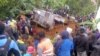 Locals surround a house that was covered by a landslide in the town of Mendi after an earthquake struck Papua New Guinea's Southern Highlands in this image taken Feb. 27, 2018, obtained from social media.