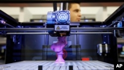 FILE - A 3D desktop printer is on display at the International Consumer Electronics Show in Las Vegas, Nevada.