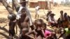 FILE - Children shelter from the sun in Ankilimarovahatsy, Madagascar, a village in the far south of the island where most children are acutely malnourished, Nov. 9, 2020. 