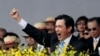 FILE - Taiwan's President Ma Ying-jeou cheers with the audience during National Day celebrations in front of the Presidential Office in Taipei, Taiwan.