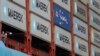 FILE - Crew members look out from the world's largest container ship, the MV Maersk Mc-Kinney Moller.