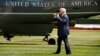 FILE - President Donald Trump walks on the South Lawn of the White House in Washington to board Marine One helicopter for a short trip to Andrews Air Force Base, Maryland, en route to Bedminster, N.J., for vacation, Aug. 4, 2017.