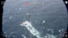 A fishing boat carrying migrants is seen from Italian coast guard helicopter during a search and rescue operation in Mediterranean sea on Apr. 24, 2021, in this screen grab obtained by Reuters on Apr. 25, 2021. (Italian Coast Guard/Handout via Reuters)