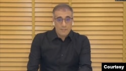 Reza Valizadeh, a former Radio Farda and Voice of America journalist shown here in an undated social media photo, was sentenced to 10 years in prison in Iran, his lawyer said on Dec. 14, 2024.