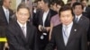 Zhang Zhijun (L), director of China's Taiwan Affairs Office, shakes hands with Mainland Affairs Council Vice Minister Chang Hsien-yao, after arriving at Taoyuan International Airport, northern Taiwan, June 25, 2014.