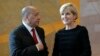 East Timorese Minister of State Agio Pereira and Australian Foreign Minister Julie Bishop talk before signing a treaty during a ceremony at United Nations headquarters, March 6, 2018. 