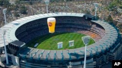 FILE - A Hot Air Balloon Flys Over The MCG on Australian Rules Football Grand Final Day in Melbourne, Australia.