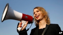 FILE - Chelsea Manning addresses participants at an anti-fracking rally in Baltimore, April 18, 2018. Chelsea Manning, who leaked classified documents, will not be allowed to enter Australia for a speaking tour scheduled to start Sunday.