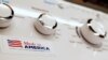 FILE - A General Electric washing machine with a label advertising it was made in America is displayed in a retail store in Cranberry Township, Pennsylvania, May 9, 2019. 