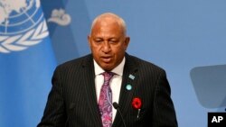 FILE - Fiji's Prime Minister Frank Bainimarama talks at the U.N. Climate Change Conference in Bonn, Germany, Nov. 6, 2017. 