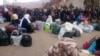 Syrians wait for the arrival of an aid convoy on Jan. 11, 2016 in the besieged town of Madaya as part of a landmark six-month deal reached in September for an end to hostilities in those areas in exchange for humanitarian assistance.