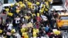 Restaurant and bar owners, employees and union workers march on 42nd Street in support of the restaurant industry, Dec. 15, 2020, in New York.
