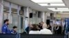 Passengers stand in line as they wait to pass through a Transportation Security Administration checkpoint at LaGuardia airport, Jan. 7, 2019, in New York.