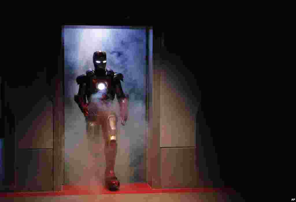A performer dressed as the Marvel comic character Iron Man arrives at the new attraction "Iron Man Experience" during a media tour in Hong Kong Disneyland.